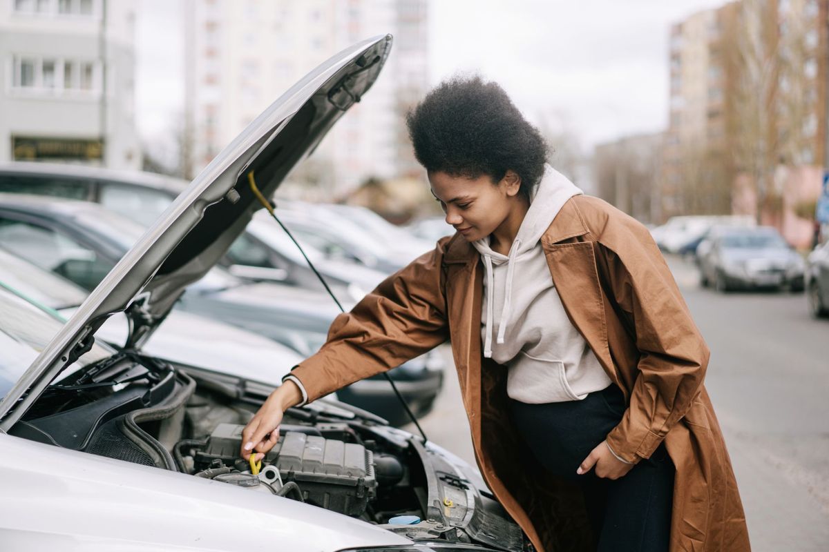 mechanic checking car battery
