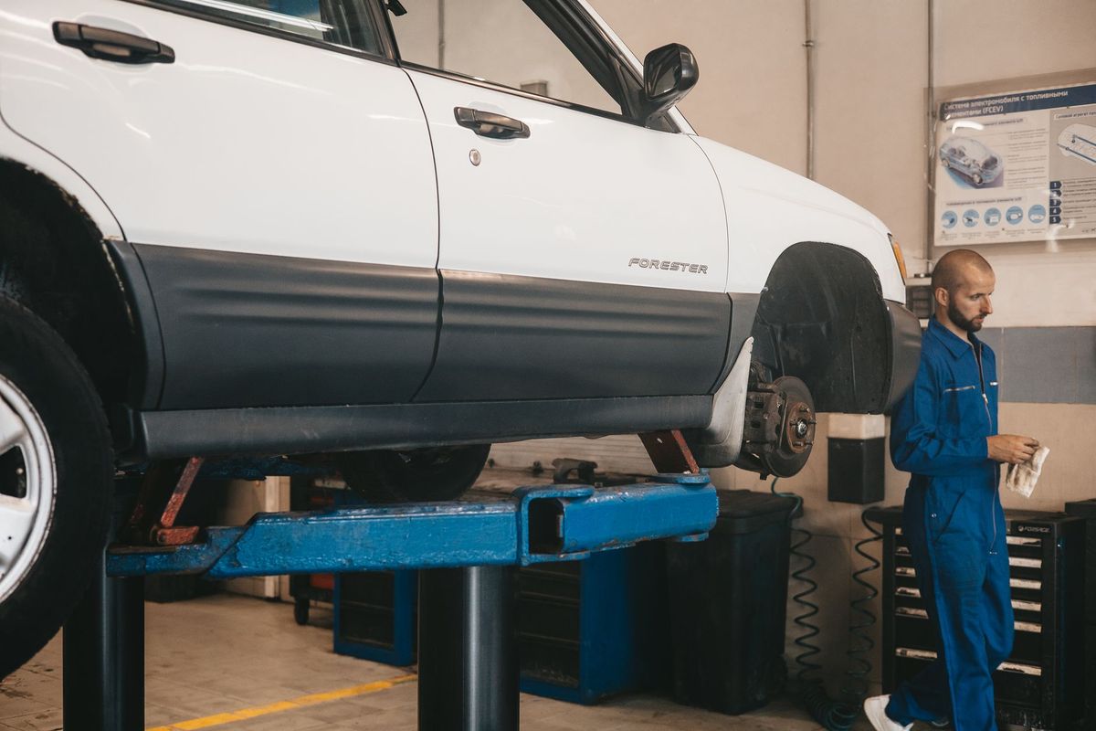 mechanic checking car battery