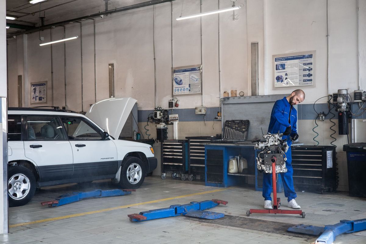 mechanic under car repair