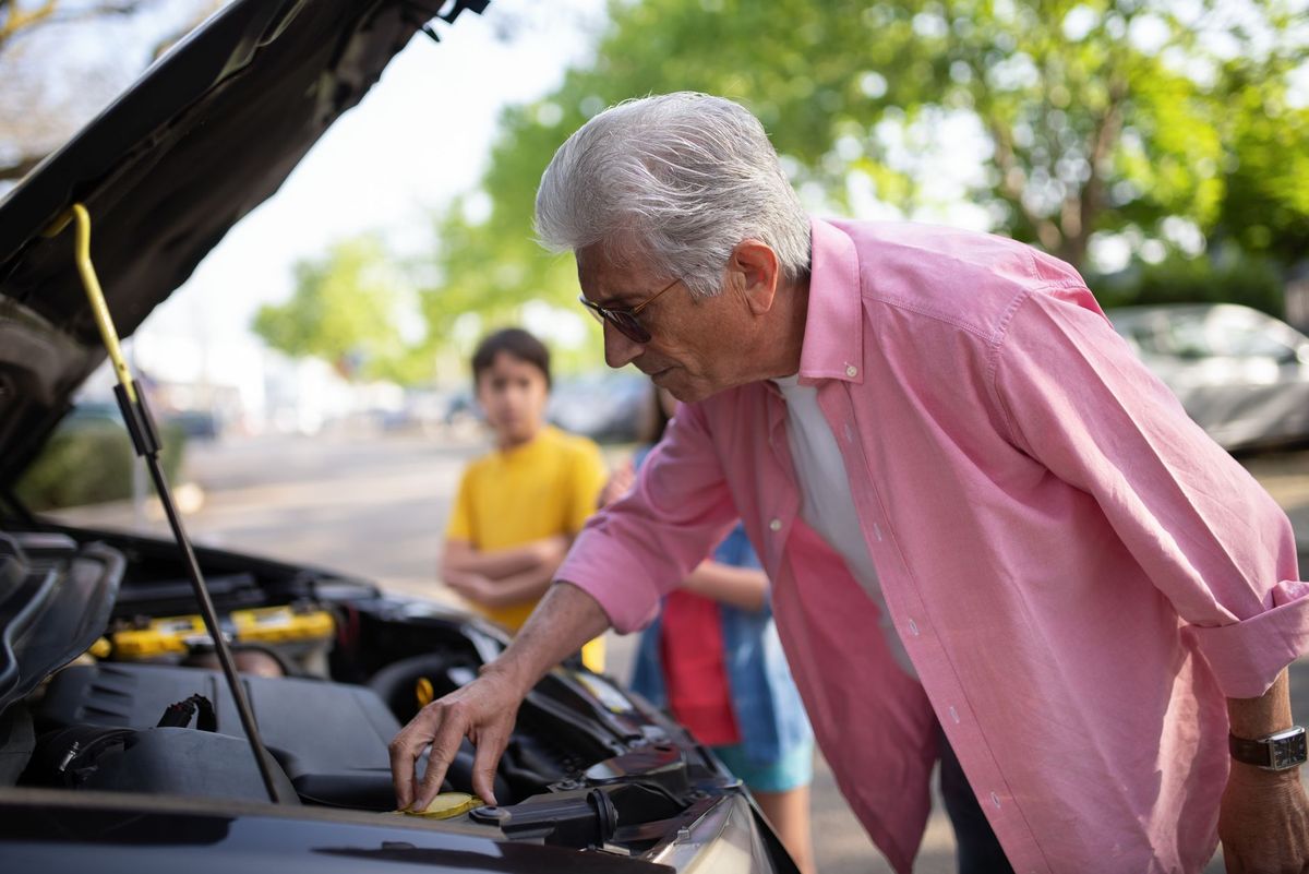 mechanic checking car battery