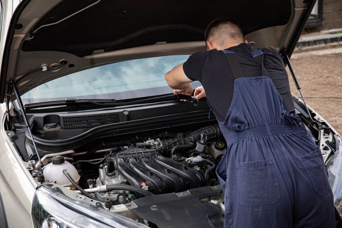 Car Making Burning Smell While Driving: Should I Stop?