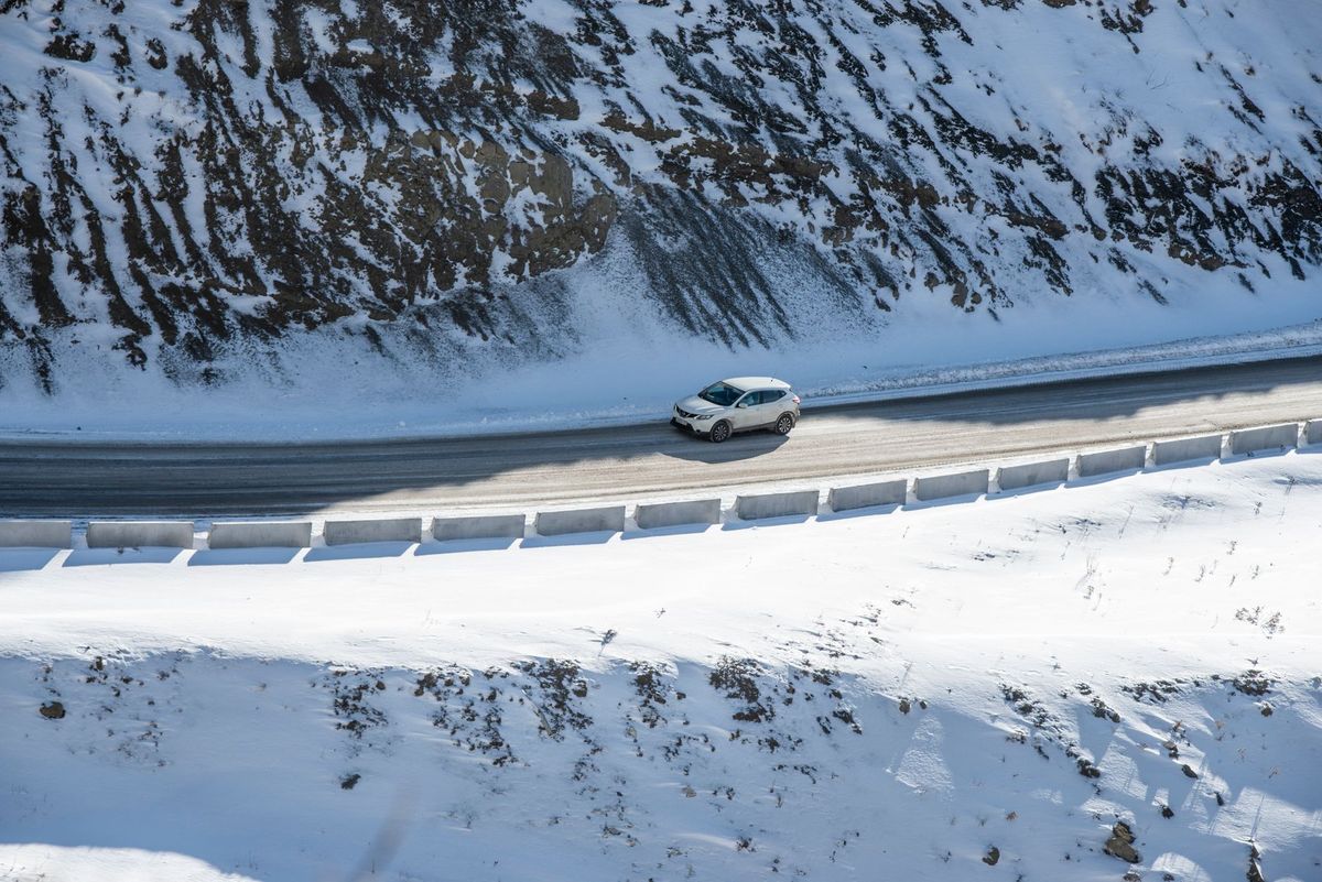 Car Stuck in Snow Ditch: Who to Call Right Now