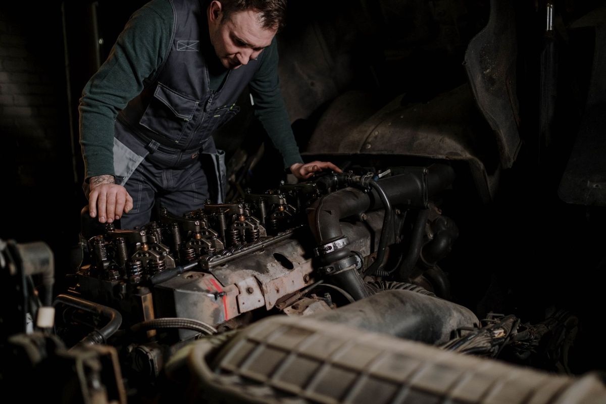 mechanic checking car battery